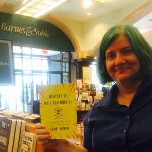Cathy O'Neil holding her new book: Weapons of Math Destruction at a Barnes & Noble in NYC.